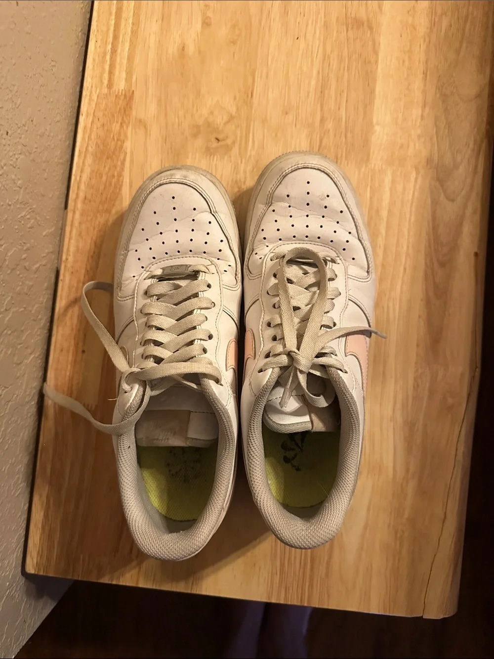 Nike White Low-Top Sneakers with Light Pink Swoosh